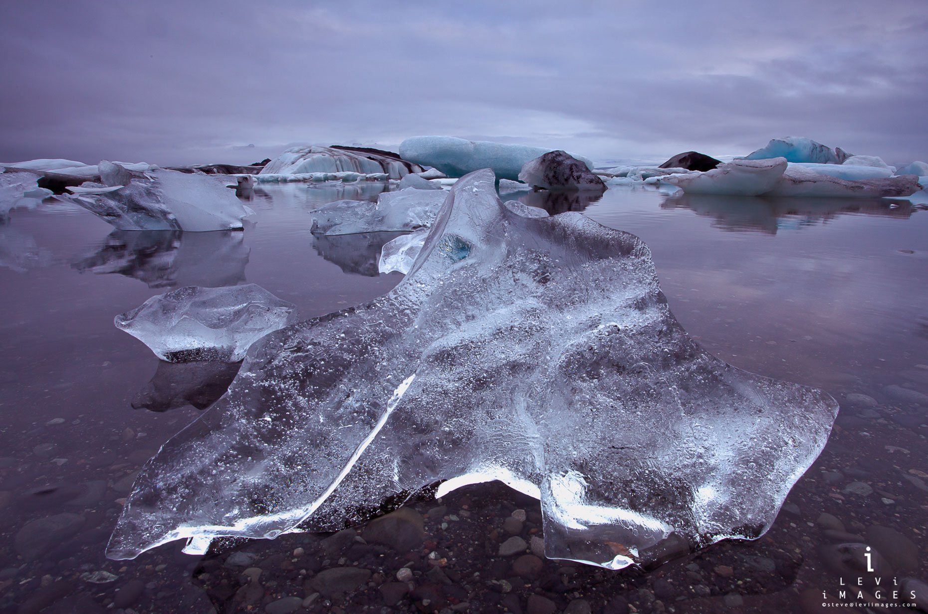 Jökulsárlón lagoon ice sculpture dusk. Iceland